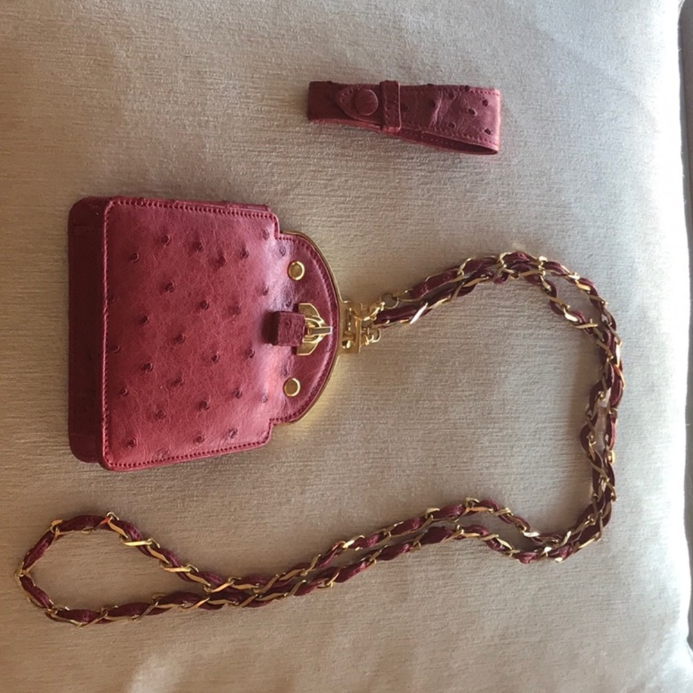 Mini cross bag with extra belt loop attachment ostrich. Giorgio’s Palm Beach.